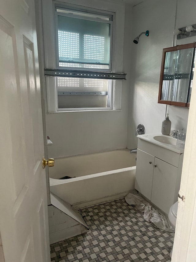 full bathroom with tile patterned flooring, vanity, tub / shower combination, and toilet