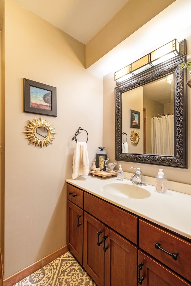 bathroom with vanity and tile patterned flooring