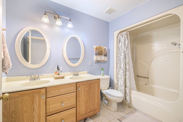 full bathroom featuring tile patterned flooring, vanity, toilet, and shower / tub combo with curtain