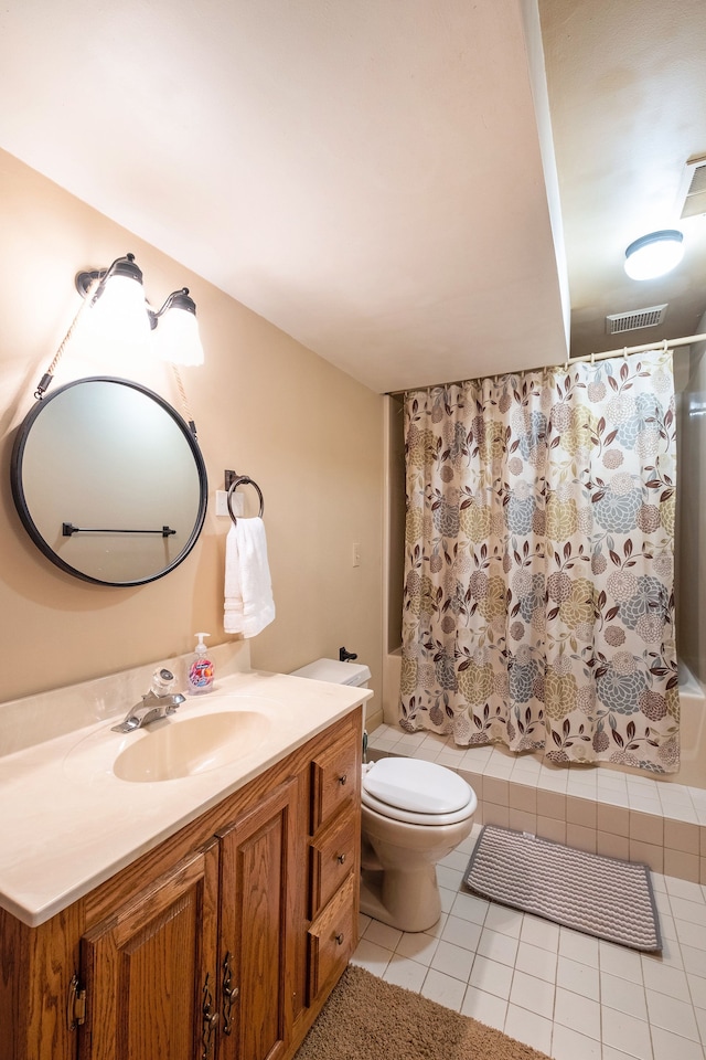 full bathroom with vanity, toilet, tile patterned flooring, and shower / bath combo