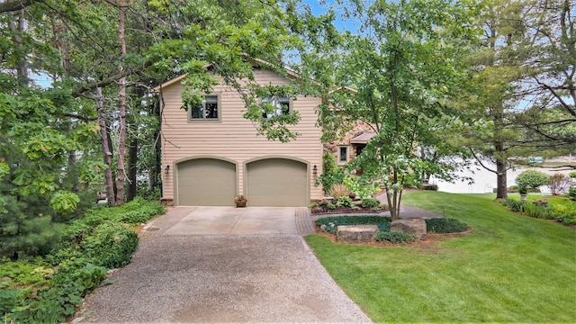 view of front of property featuring a garage and a front lawn