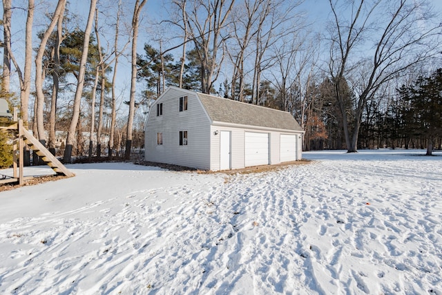 view of snow covered garage