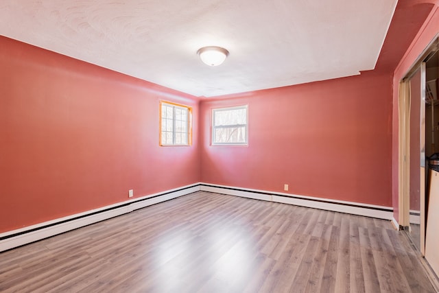 spare room with light hardwood / wood-style floors