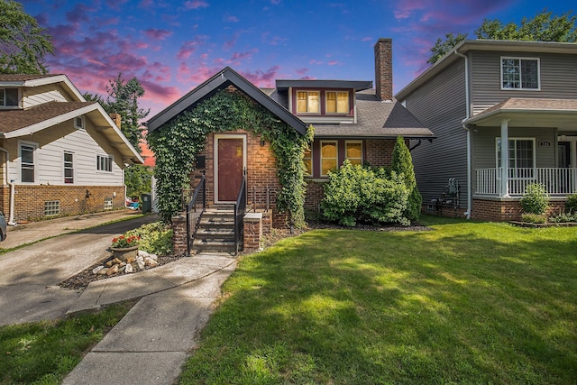 view of front of house with a yard