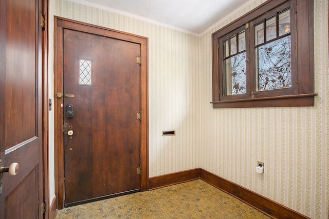 foyer entrance featuring ornamental molding