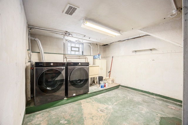 laundry area featuring independent washer and dryer