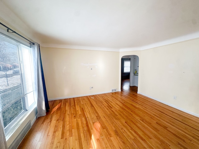 unfurnished room with light hardwood / wood-style flooring