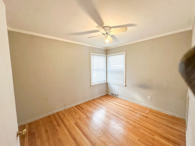 unfurnished room featuring ceiling fan, ornamental molding, and light hardwood / wood-style floors