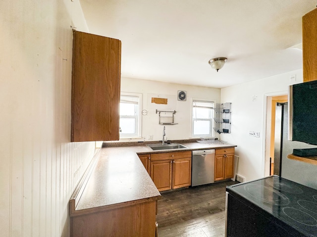 kitchen with dark hardwood / wood-style flooring, sink, range with electric stovetop, and stainless steel dishwasher