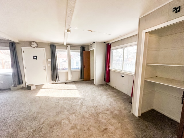 unfurnished living room with carpet floors