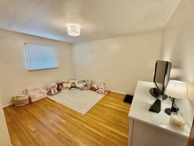 recreation room featuring light wood-type flooring