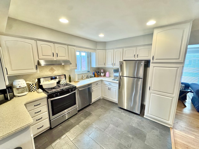 kitchen featuring white cabinetry and stainless steel appliances