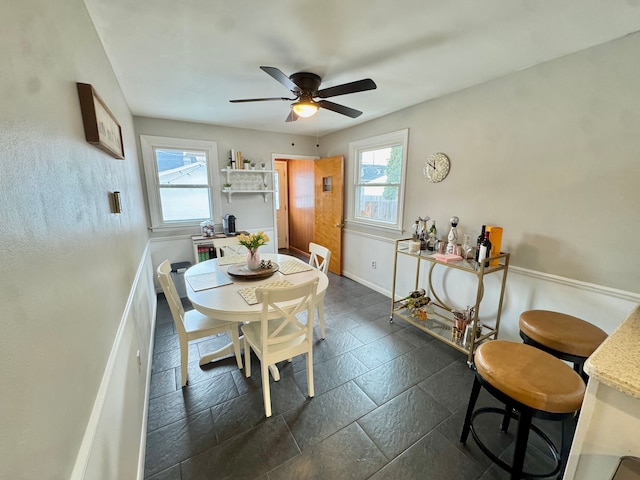 dining space featuring a wealth of natural light and ceiling fan