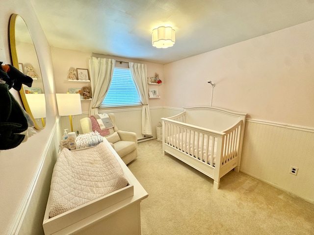 bedroom featuring light colored carpet and a crib