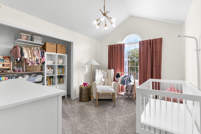 carpeted bedroom featuring vaulted ceiling, a nursery area, and a chandelier