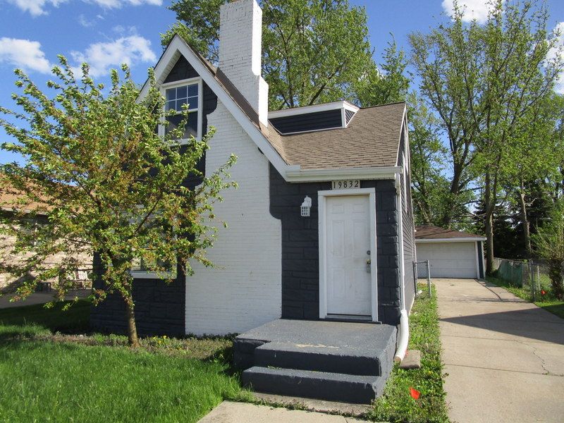 view of front of house featuring a garage and an outdoor structure