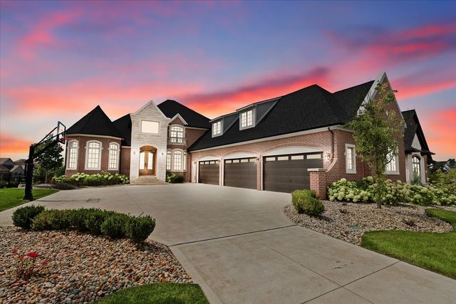 french country home with a garage