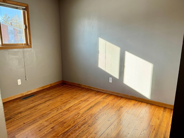 spare room featuring light hardwood / wood-style flooring