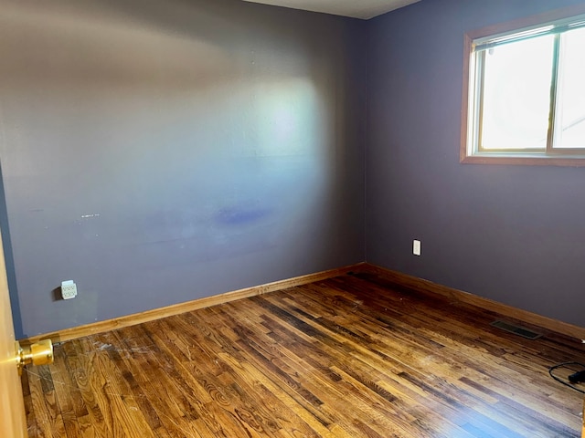 unfurnished room featuring wood-type flooring