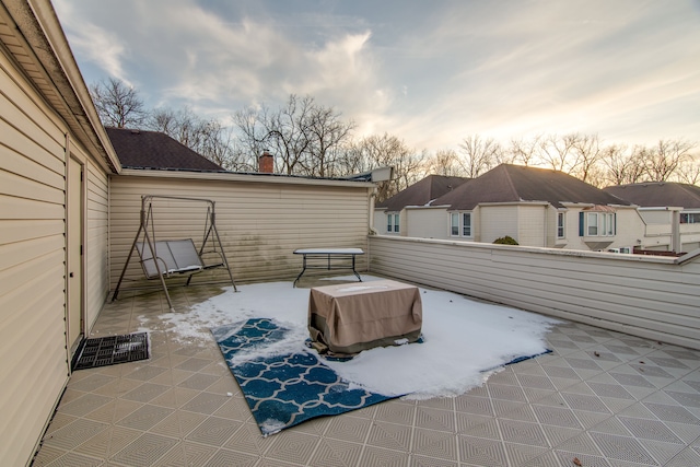 view of patio terrace at dusk