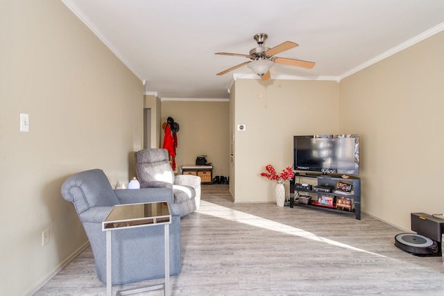 living room featuring crown molding, ceiling fan, and hardwood / wood-style floors