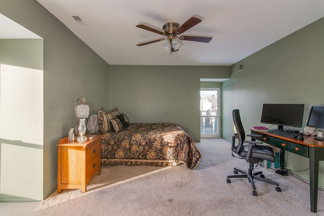 bedroom featuring ceiling fan and light carpet