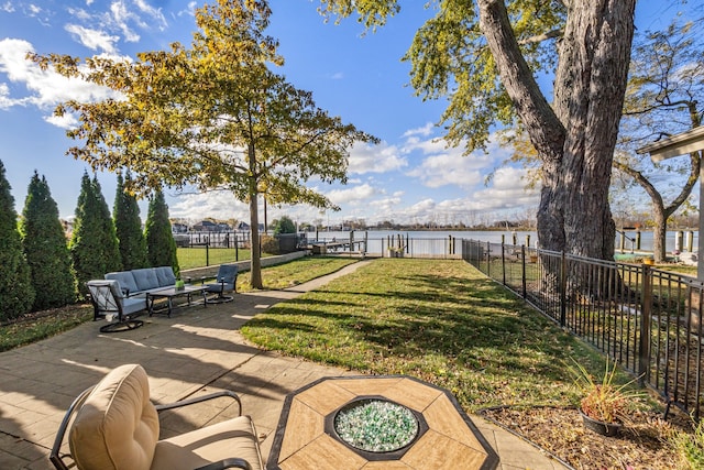 view of yard featuring a patio area and an outdoor living space with a fire pit