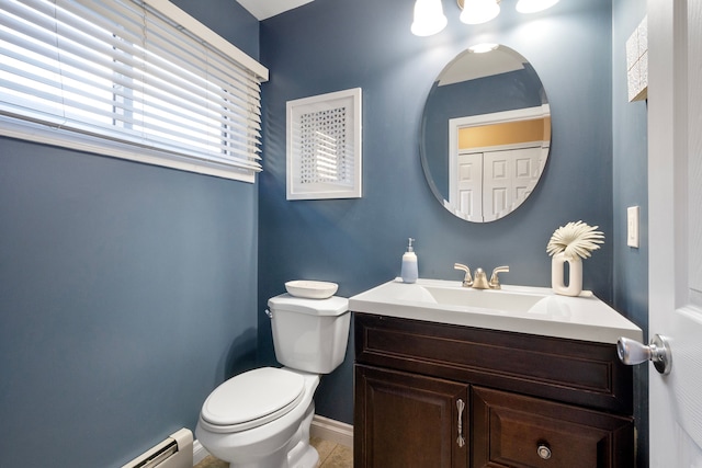 bathroom with vanity, a baseboard radiator, and toilet