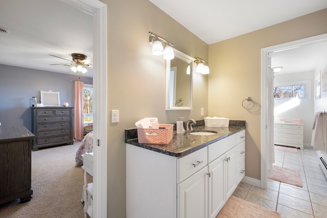 bathroom featuring tile patterned flooring, vanity, and ceiling fan