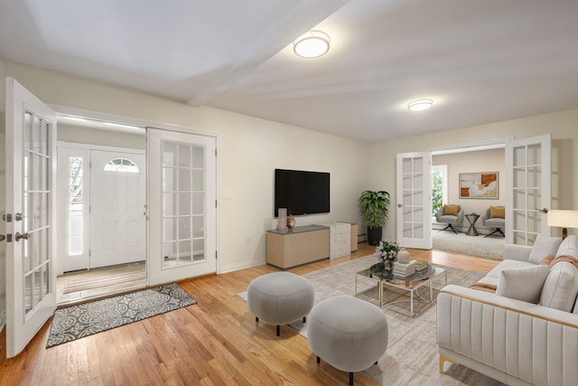 living room with french doors and light wood-type flooring