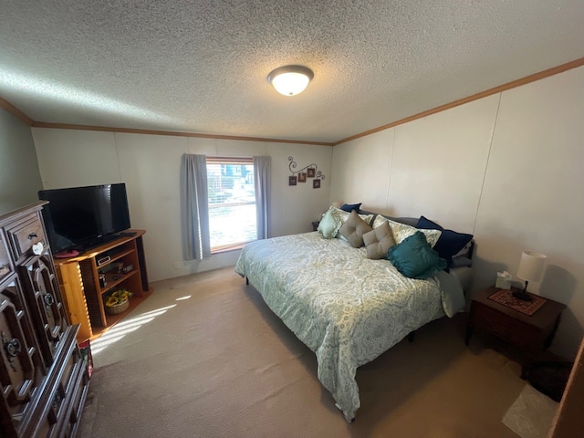 bedroom featuring crown molding, carpet floors, and a textured ceiling