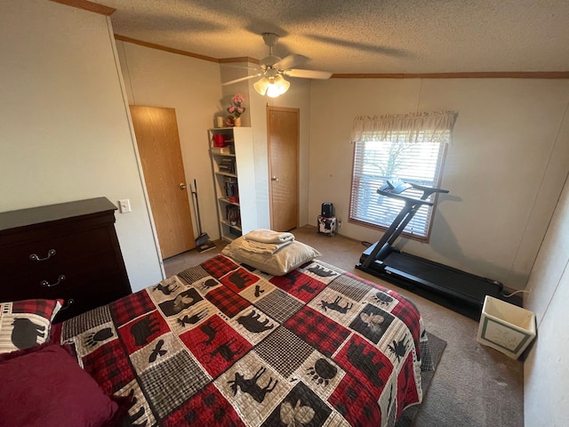 carpeted bedroom with ceiling fan, ornamental molding, and a textured ceiling