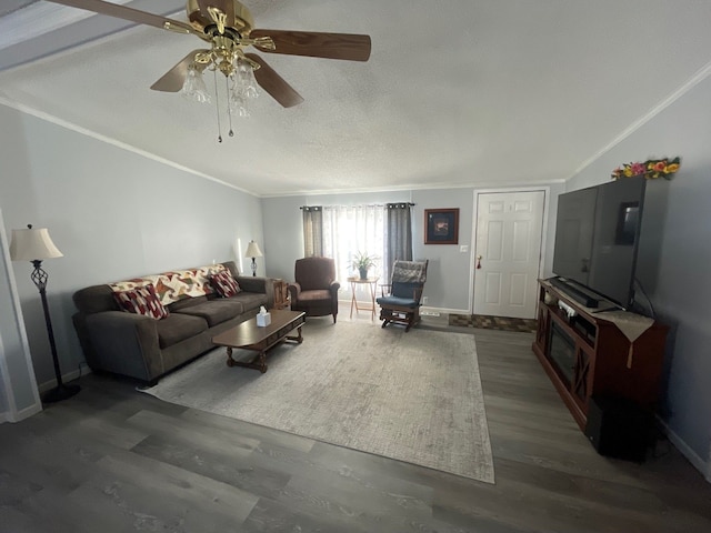 living room featuring ornamental molding, dark hardwood / wood-style floors, ceiling fan, and a textured ceiling