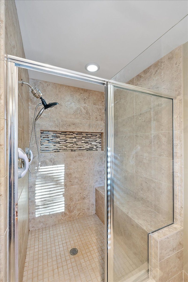 bathroom with a tile shower