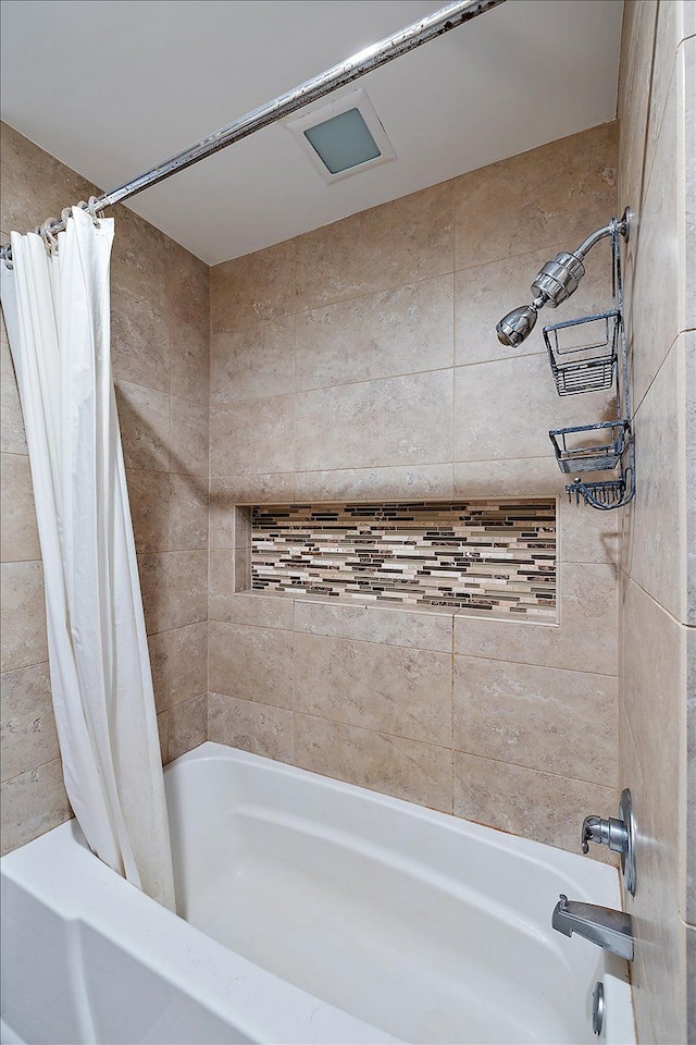 bathroom featuring shower / tub combo