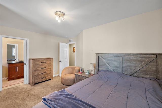 bedroom featuring light colored carpet