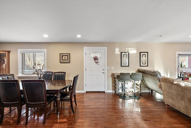 dining space with dark hardwood / wood-style floors