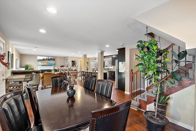 dining room with dark wood-type flooring