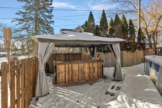 snow covered deck with a gazebo