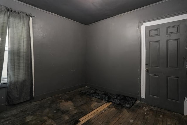 spare room with dark hardwood / wood-style flooring