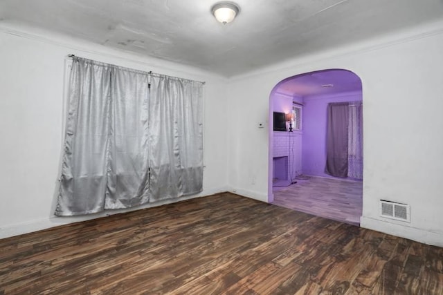 spare room featuring dark hardwood / wood-style floors