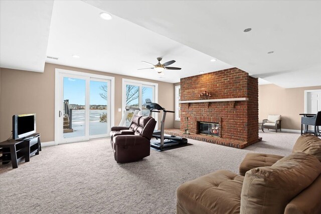 10587 Lighthouse, South Lyon, MI 48178 - living room featuring carpet floors, a ceiling fan, baseboards, and a brick fireplace