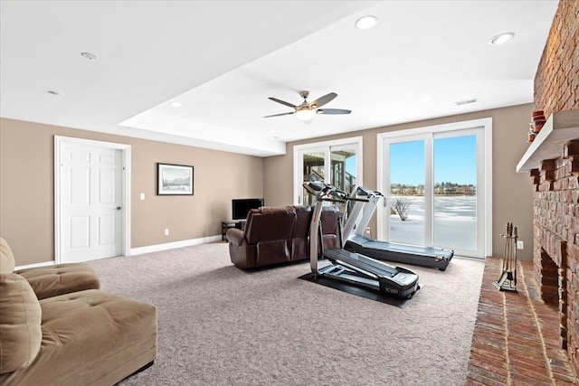 10587 Lighthouse, South Lyon, MI 48178 - carpeted living room featuring a brick fireplace, ceiling fan, recessed lighting, and baseboards