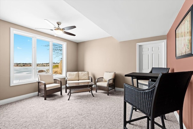 10587 Lighthouse, South Lyon, MI 48178 - living area with baseboards, carpet flooring, and ceiling fan