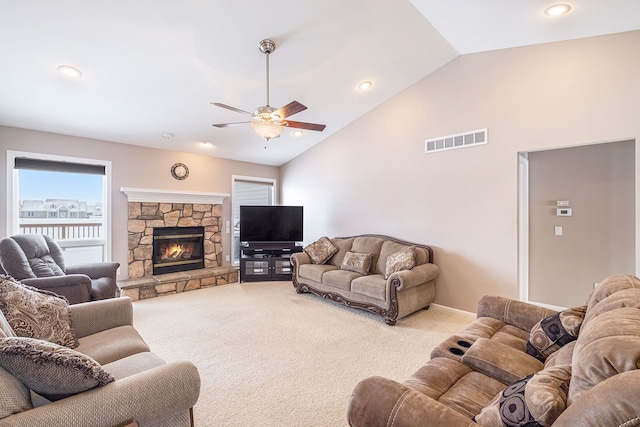 living room with ceiling fan, a fireplace, high vaulted ceiling, and carpet