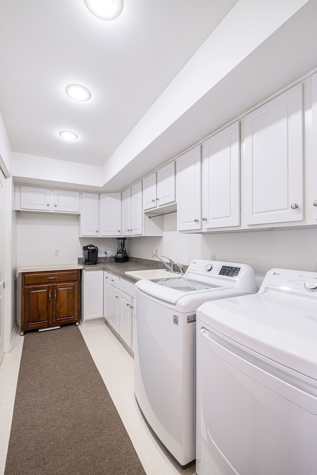 laundry area with sink and washing machine and clothes dryer