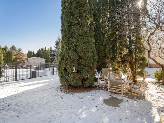 view of yard layered in snow