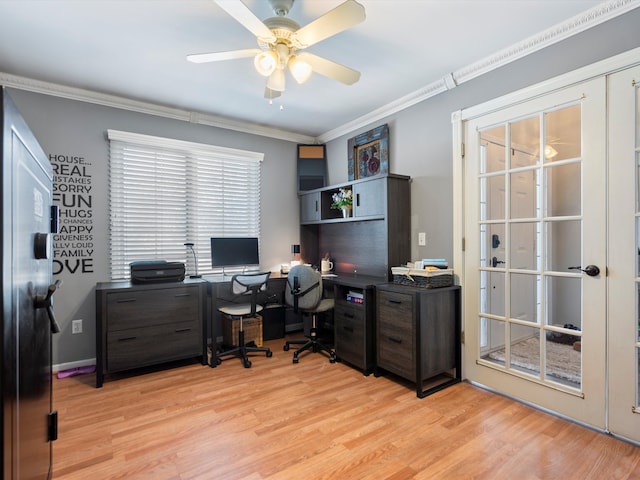 office space with crown molding, ceiling fan, and light wood-type flooring