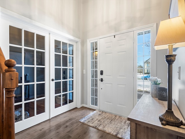 foyer entrance featuring hardwood / wood-style floors and french doors