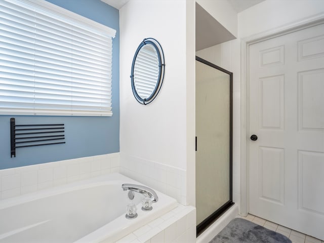 bathroom featuring separate shower and tub and tile patterned floors